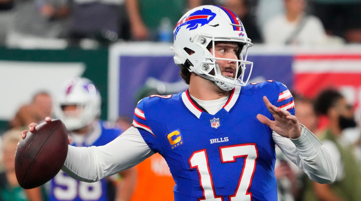 Josh Allen pulls his arm back to throw the ball